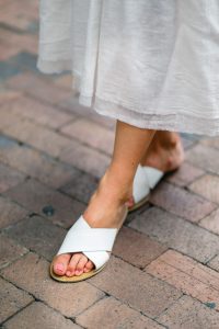 white-forever-21-slide-on-sandals-and-pink-nail-polish